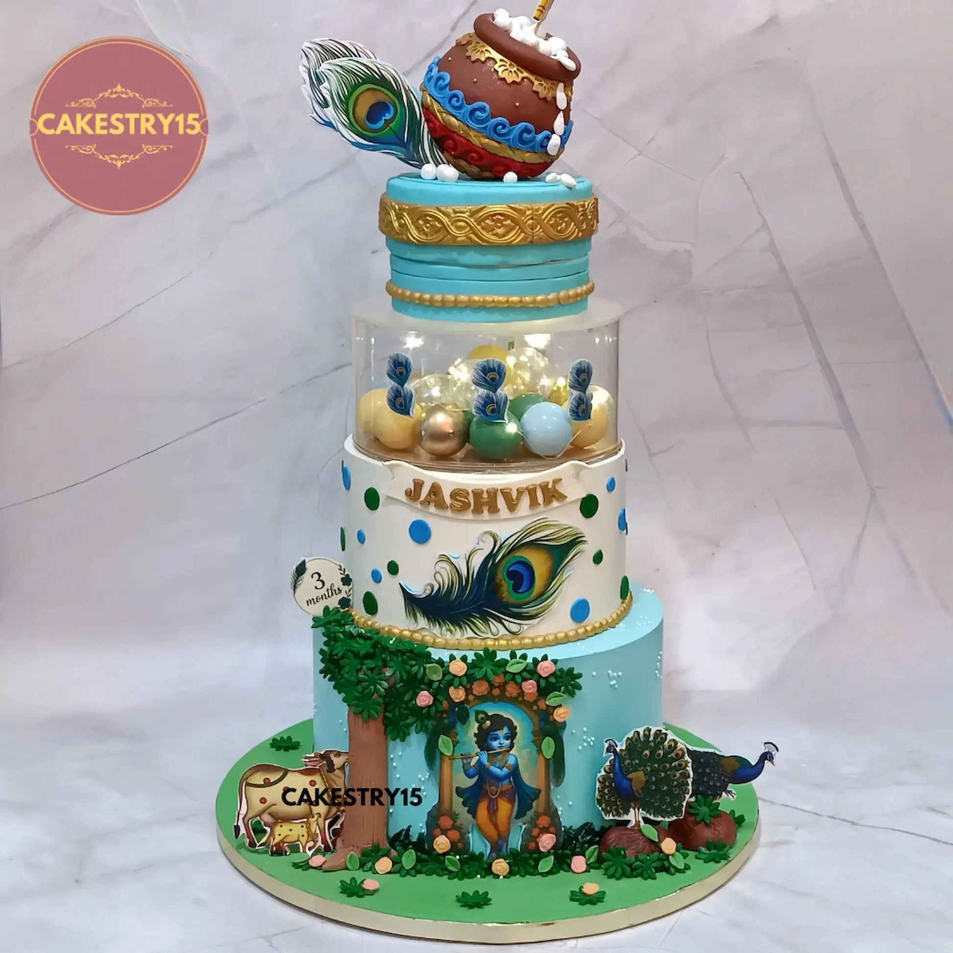 5kg choco vanilla Krishna theme first birthday cake with rotating dahi handi, edible Krishnaji, peacocks, and fondant decorations by cakestry1 in noida