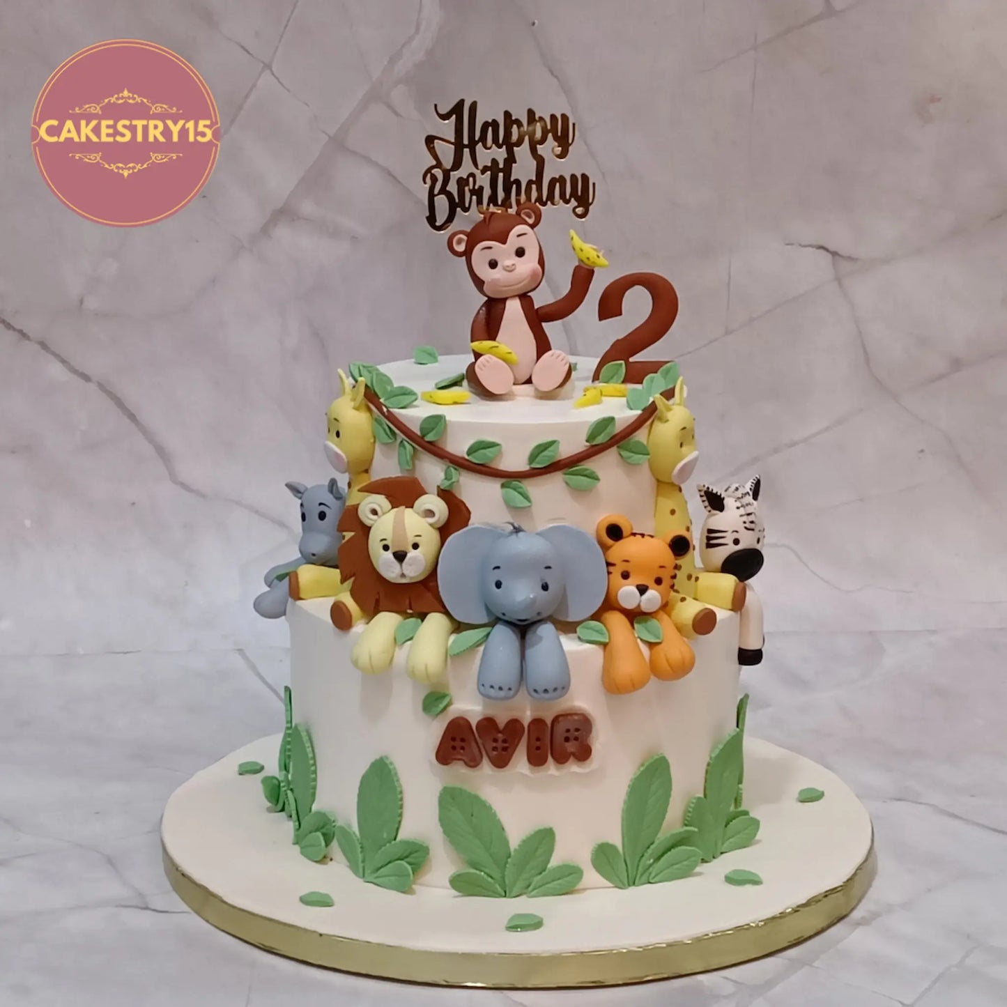 Jungle animals 2nd birthday cake eggless kids birthday cake in Noida with animal figurines and leaf design