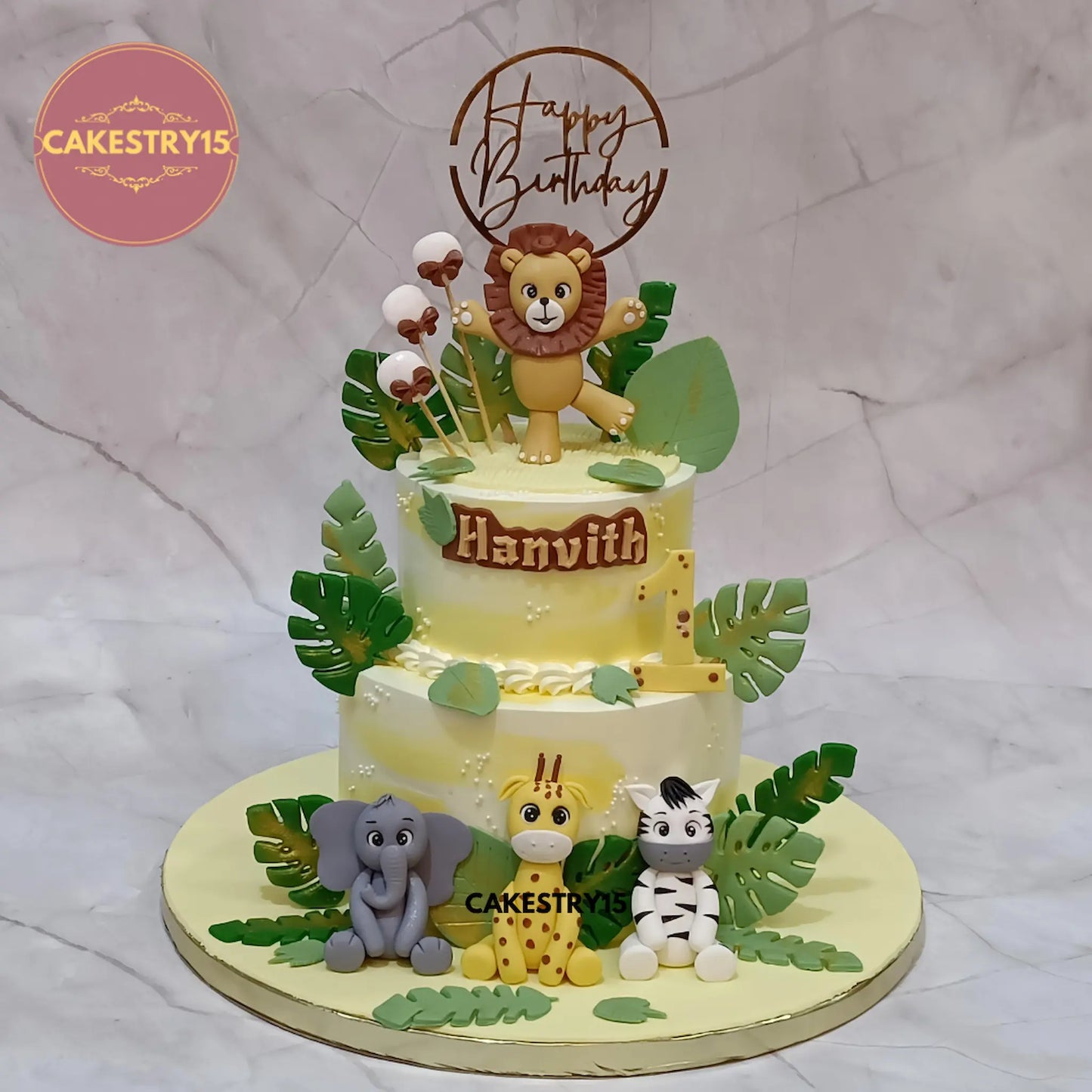 Jungle kids birthday cake with fondant animals and balloons, premium theme cake Noida for eggless cakes celebrations.