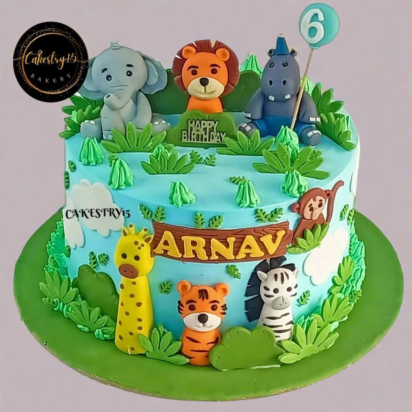 Eggless jungle family kids birthday cake with safari animals, premium theme cake Noida for birthday celebrations.