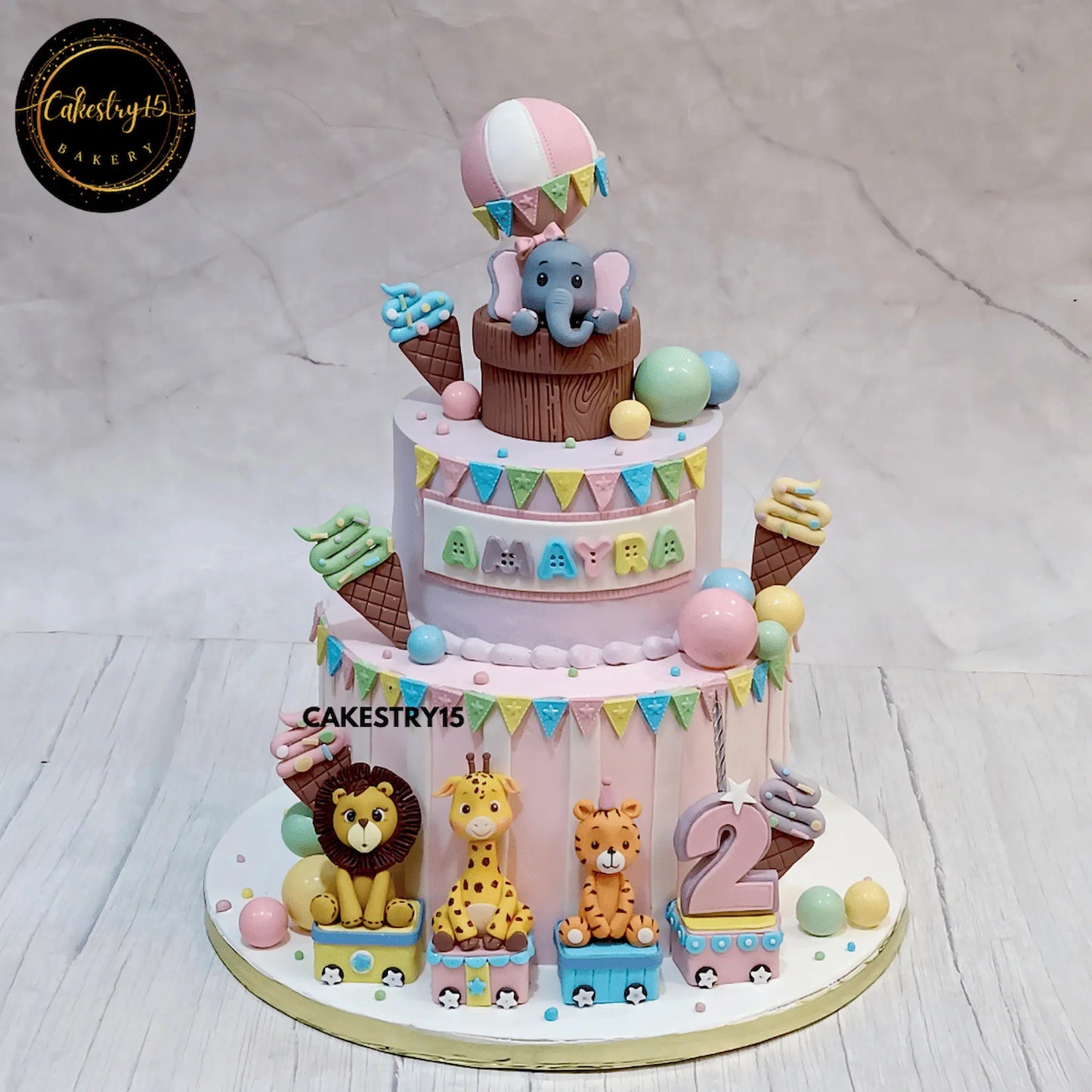 Jungle theme kids birthday cake in Noida featuring animal train design, perfect eggless cakes for themed celebrations