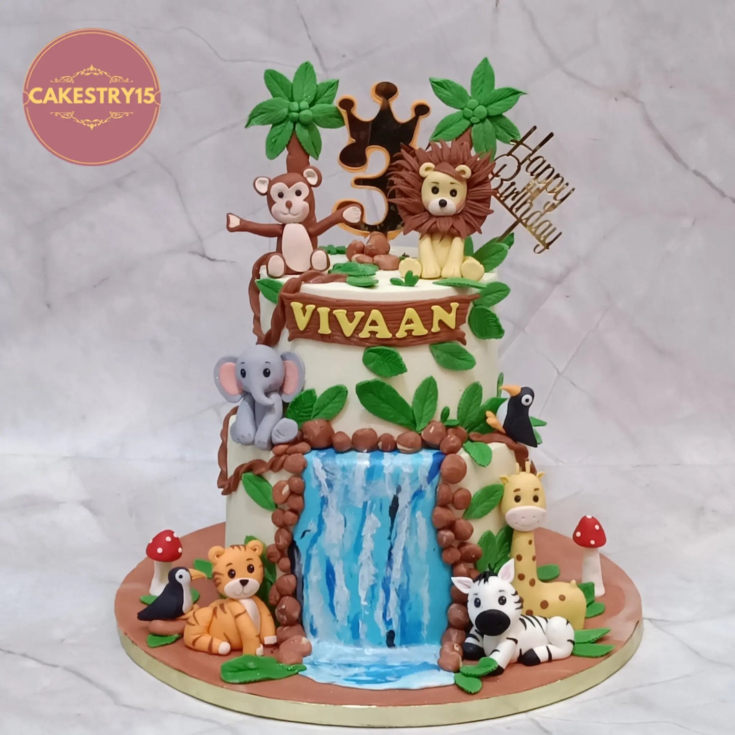 Jungle theme 3rd birthday cake with animals and waterfall for kids in Noida eggless custom cake by Cakestry15