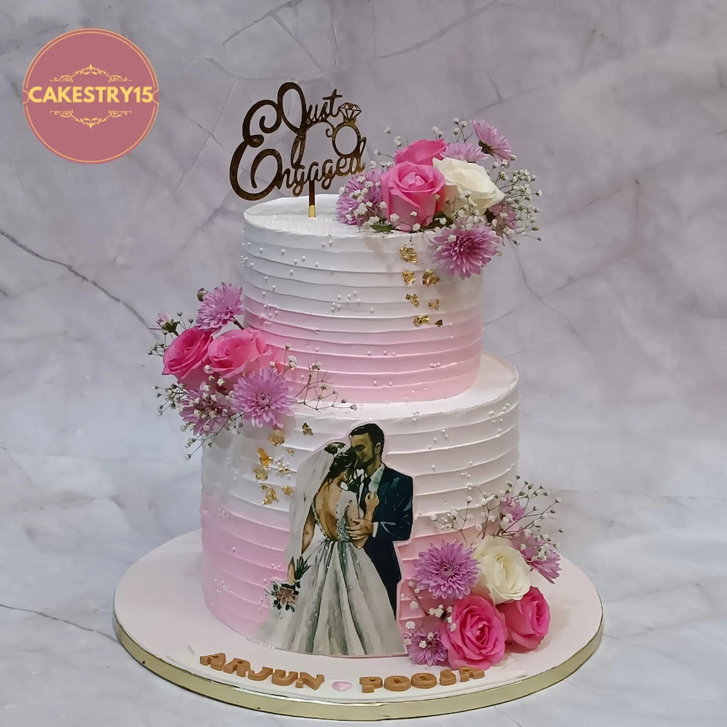 Just engaged 2 tier pineapple flavour engagement cake with pink and ivory floral design by Cakestry15 Noida