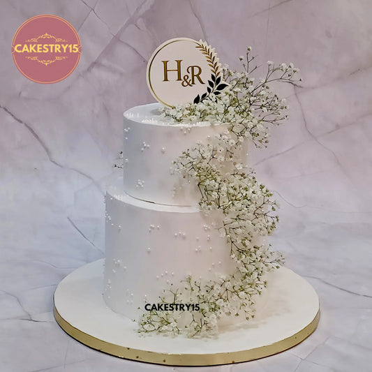 3kg pineapple engagement cake in white with H and R initials and baby breath flowers by cakestry15 in noida