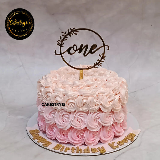 1kg chocolate smash cake with three pink rosettes for Kavya’s 1st birthday