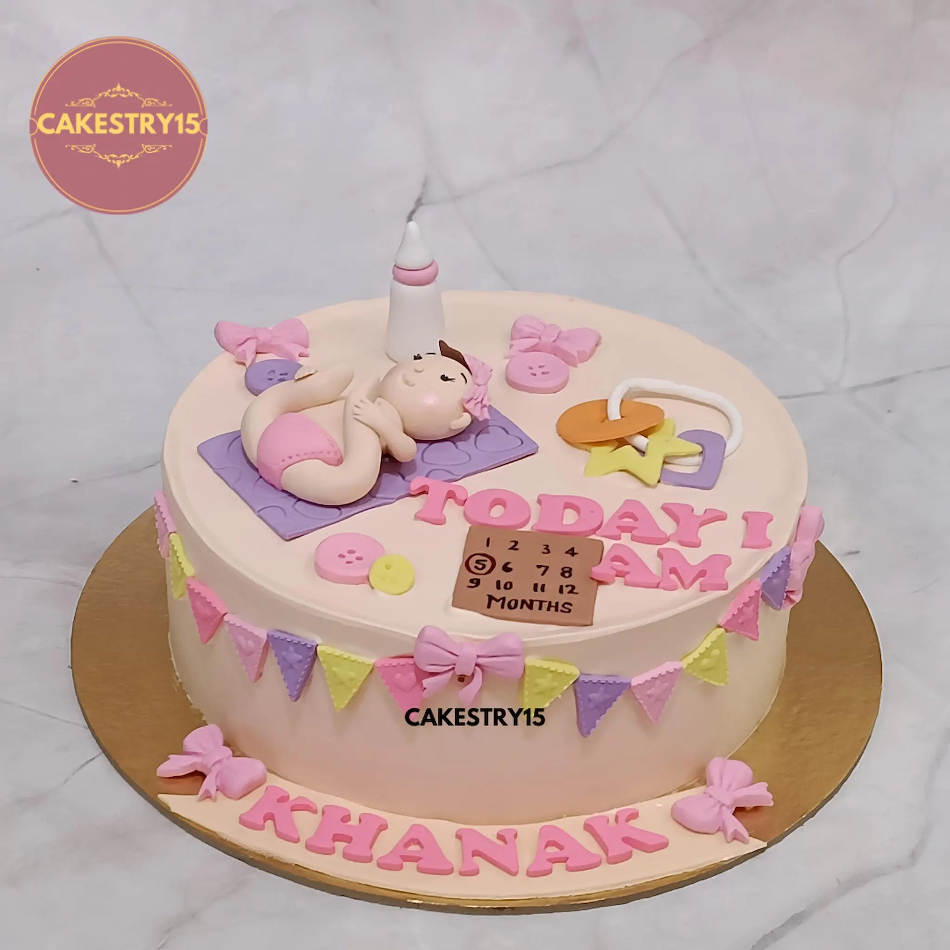 1kg black forest birthday cake with fondant baby toys and name by Cakestry15 Noida