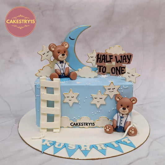 1kg pineapple half-birthday cake with teddies, moon, stars, and name on base from Cakestry15 in noida