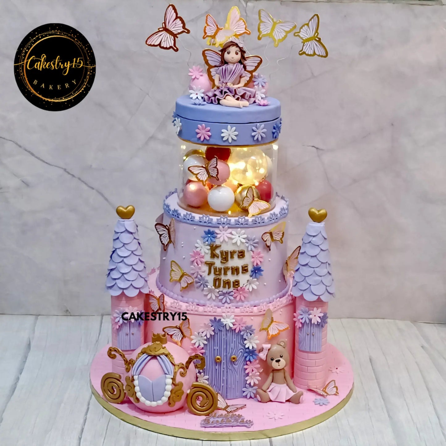 6kg two-tier chocolate princess doll birthday cake for Kyra by Cakestry15, featuring castle and rotating topper
