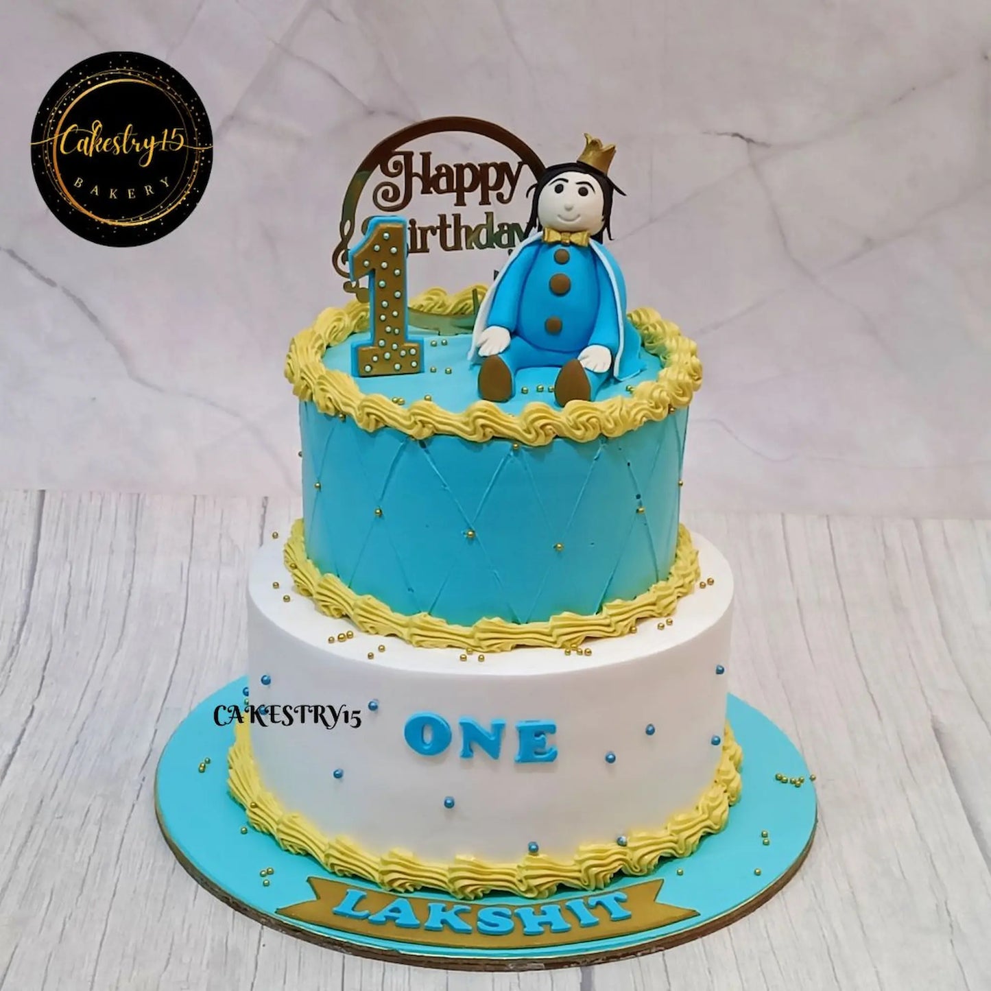 Prince-themed 3kg chocolate cake for Lakshit’s 1st birthday with fondant boy figurine