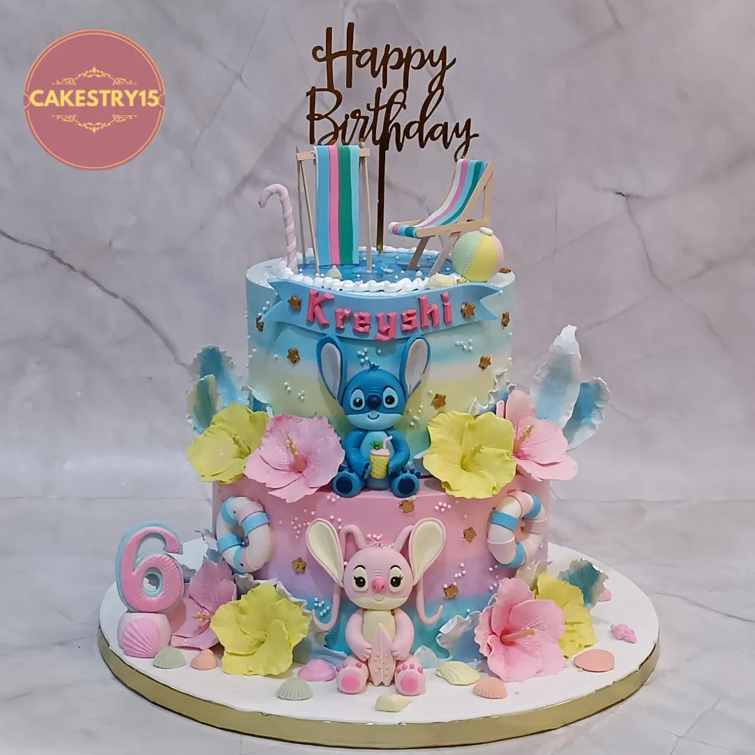 Lilo and Stitch kids birthday cake with rainbow icing and fondant figurines, premium theme cake Noida from Cakestry15 eggless cakes collection.