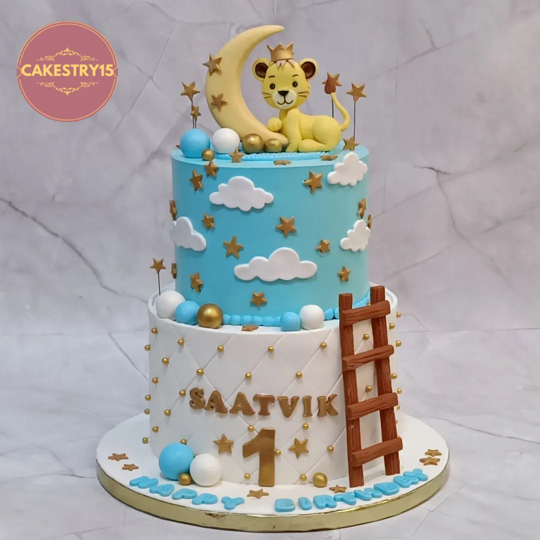 Eggless lion theme kids birthday cake in Noida with moon, stars and clouds for first birthday celebration.
