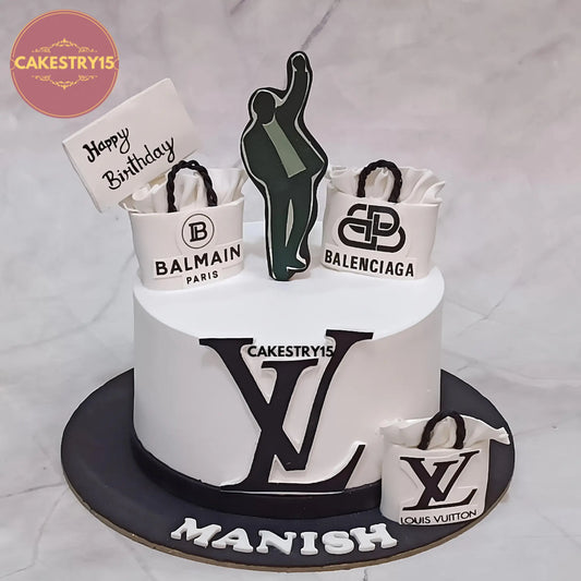 1kg chocolate birthday cake with white icing, man figure and Balenciaga, Louis Vuitton, Balmain bag theme from Cakestry15