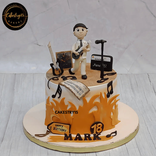 1.5kg chocolate 18th birthday cake with guitar, mic, speaker and boy figurine