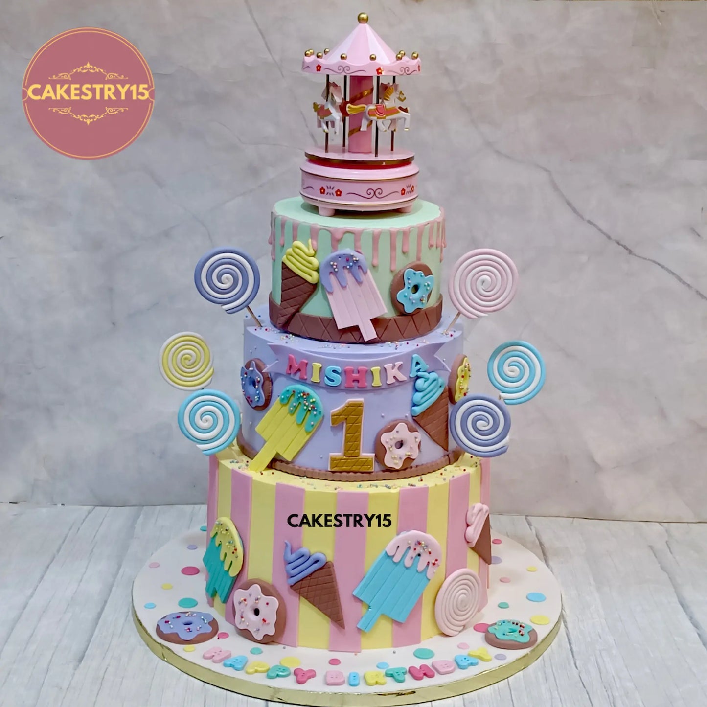 6kg chocolate 3-tier birthday cake with carousel topper, candy swirls, and donuts from Cakestry15
