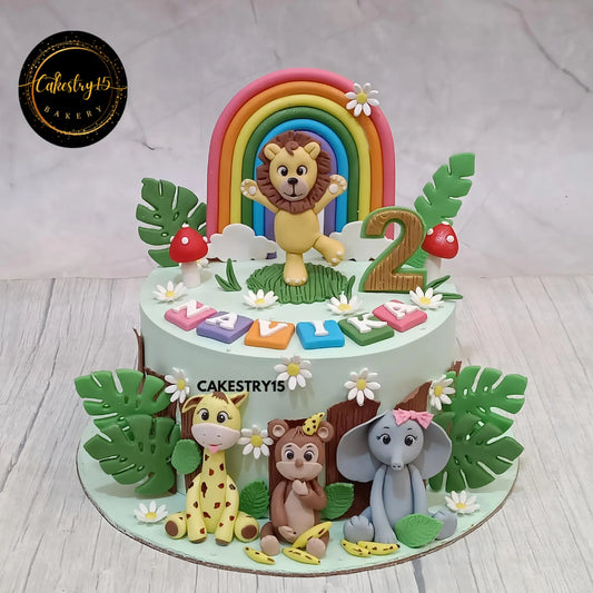 Jungle theme 1.5kg black forest birthday cake with lion, rainbow, elephant, giraffe and monkey for Navika’s 2nd birthday