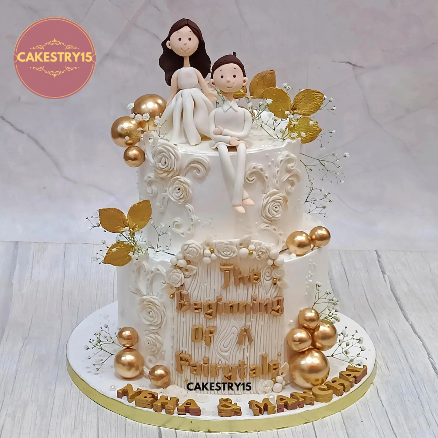 3kg black forest engagement cake with white figurines, roses, golden leaves from Cakestry15 in noida
