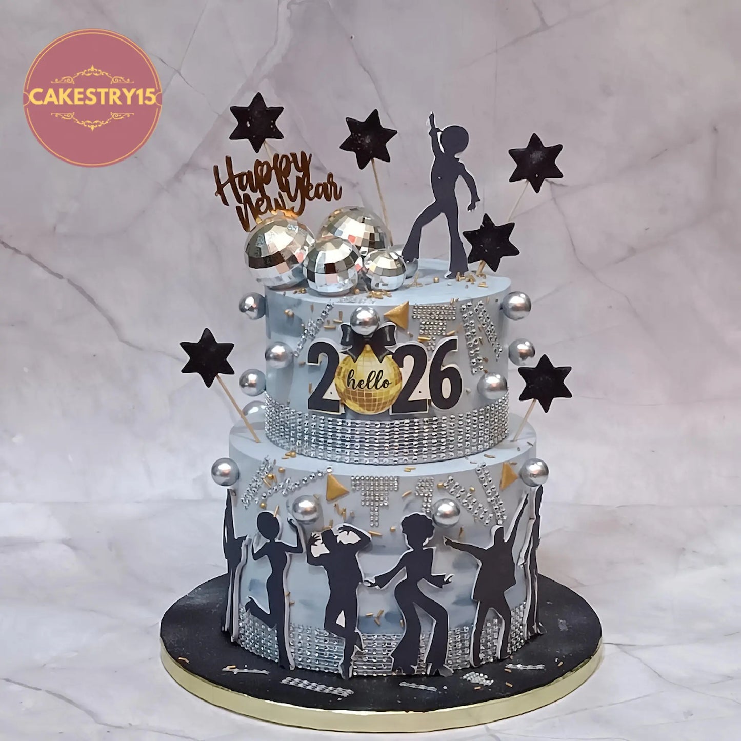 New Year 2026 corporate celebration cake with grey icing, silver disco balls and eggless choco vanilla flavour in Noida