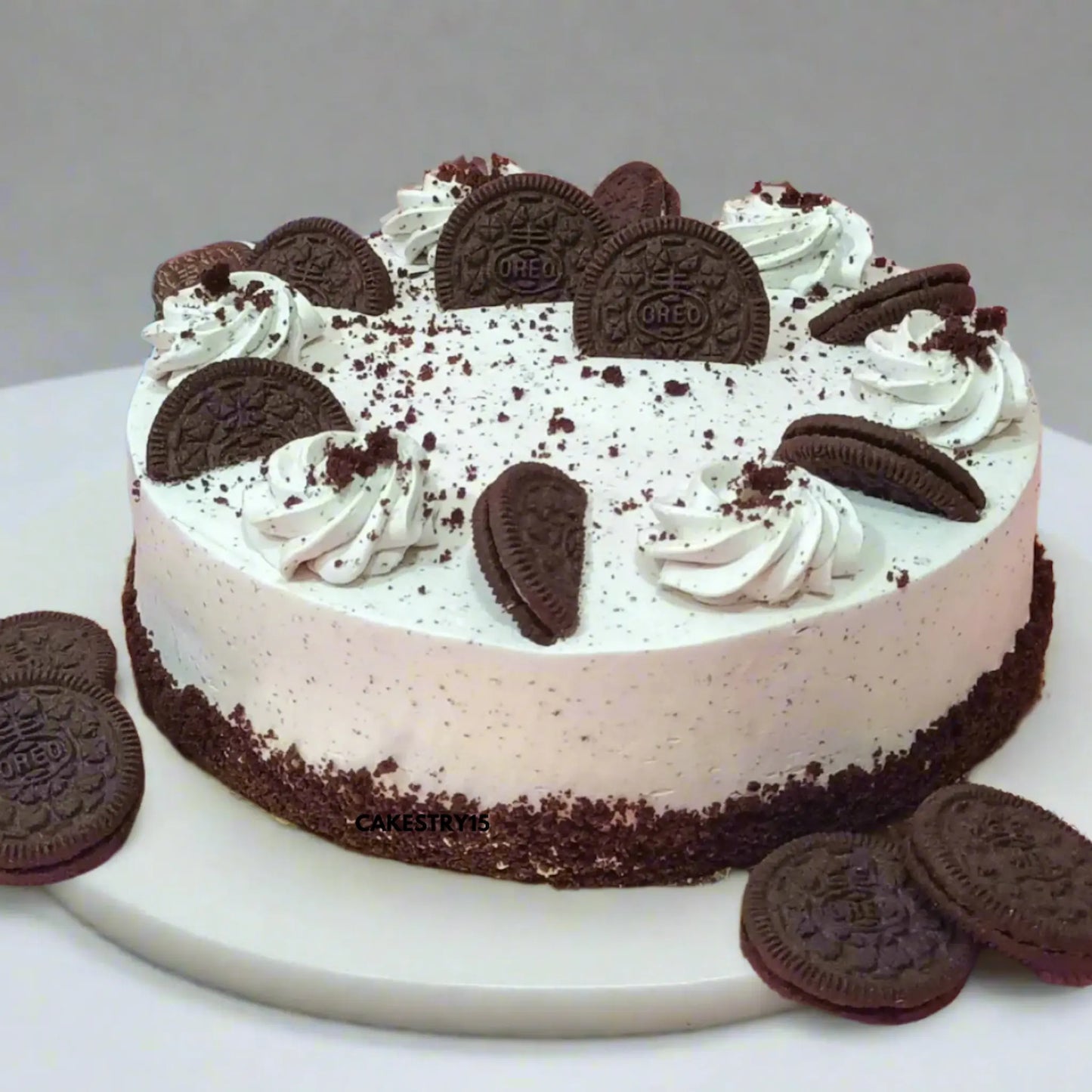 Eggless chocolate Oreo cake layered with Oreo cream and biscuits from Cakestry15