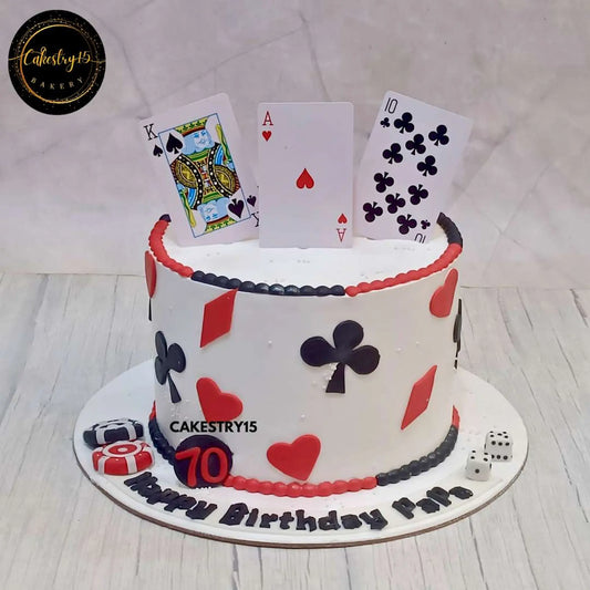 A 2kg choco chip birthday cake with playing cards, casino chips, rolling dice, and a "Happy Birthday Papa" message for a 70th birthday celebration by cakestry15,best bakery in noida