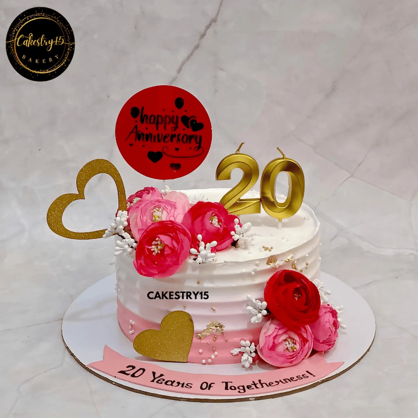 1kg pineapple cake with faux peonies and 20 years anniversary tag by cakestry15 noida