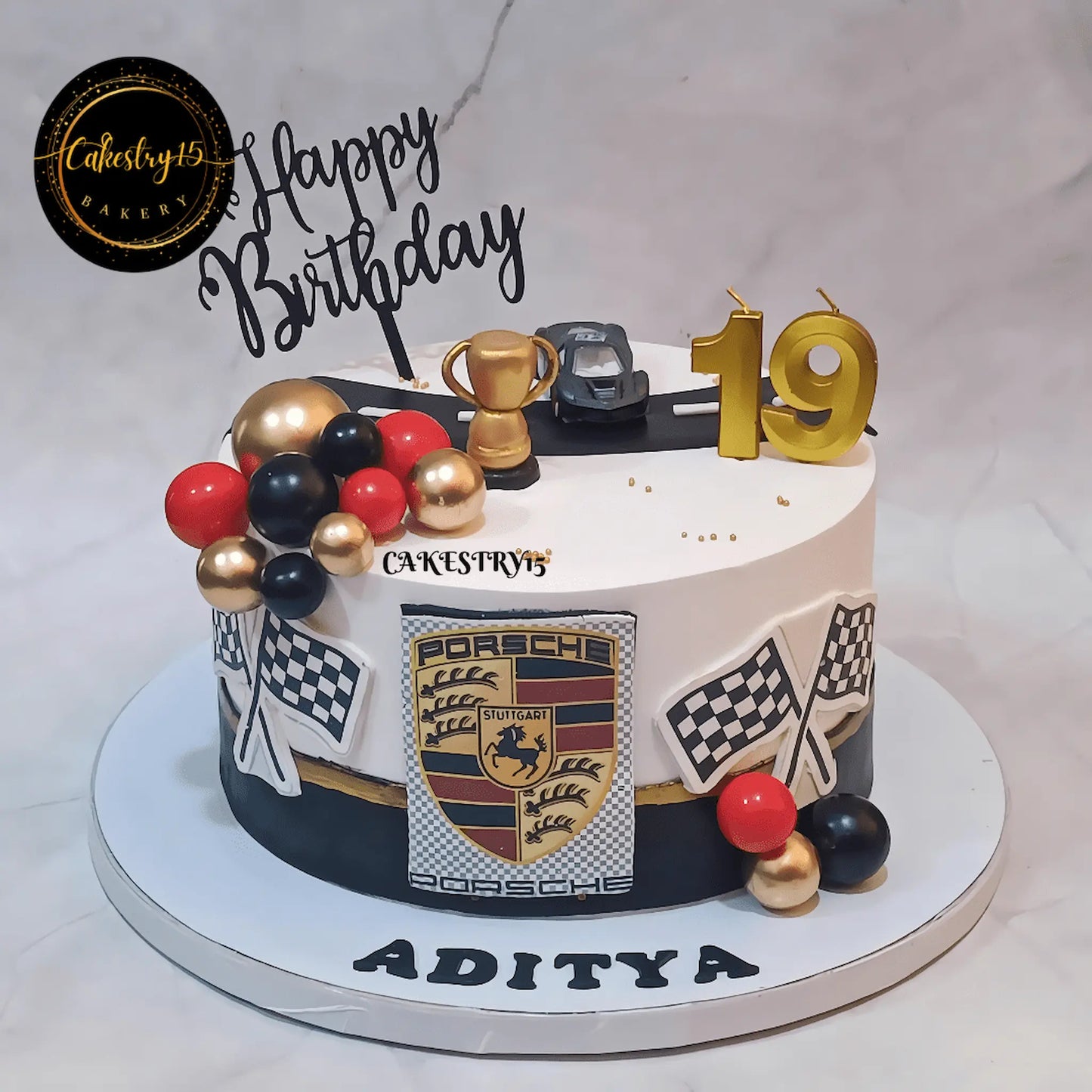 Eggless Porsche theme chocolate birthday cake with racing design and luxury fondant detailing in Noida by Cakestry15