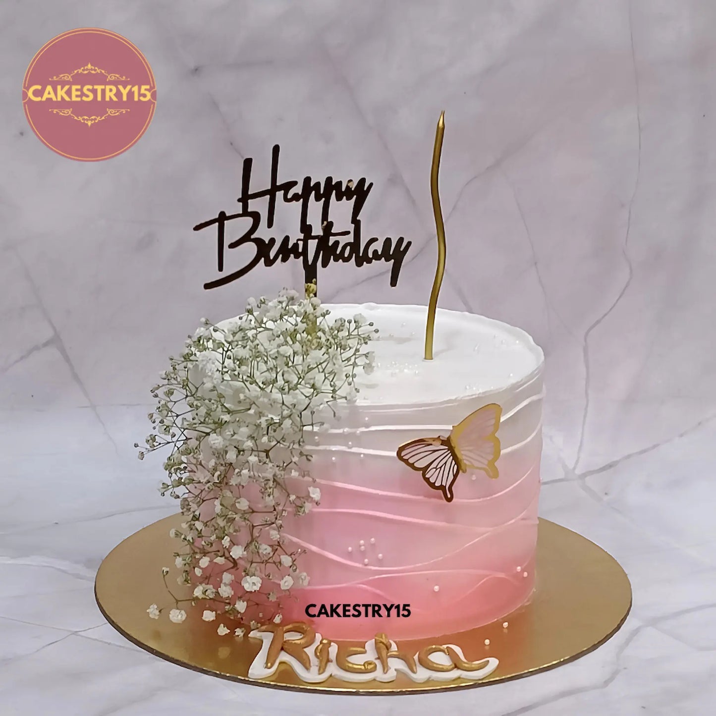 1kg chocolate floral birthday cake with baby’s breath, butterfly, and golden candle from Cakestry15 Noida