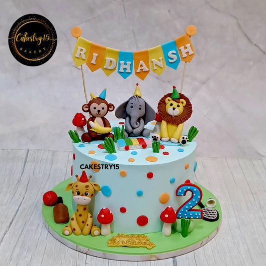 Ridhansh’s 2nd birthday jungle cake with monkey, lion, elephant, giraffe and mushrooms