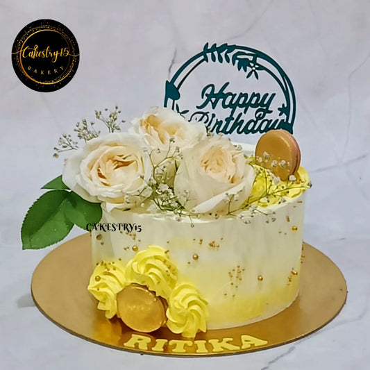 1kg floral pineapple cake by Cakestry15 topped with ivory roses, baby breath, fondant macarons, and yellow rosettes