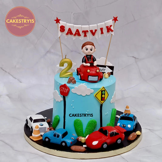 Eggless 1.5kg choco vanilla car theme birthday cake with fondant cars for 2nd birthday from Cakestry15 Noida