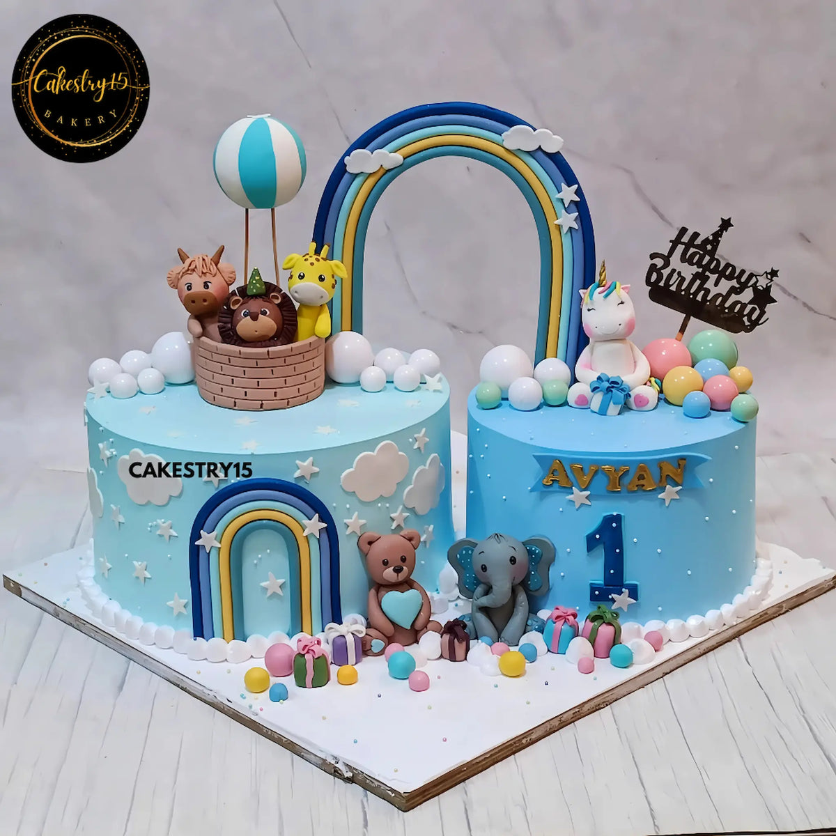 Safari unicorn wonderland kids birthday cake in blueberry flavour, a detailed eggless theme cake Noida for a first birthday.