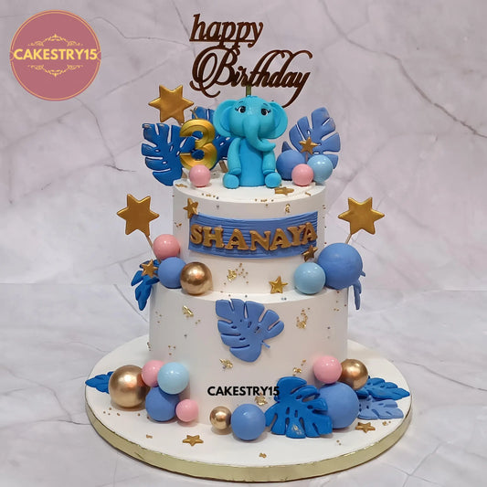 2kg pineapple birthday cake with baby elephant topper, palm leaves, golden stars and age 3 candle from Cakestry15