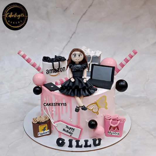Shopaholic birthday theme cake for Gillu with girl figurine, shopping bags, and chocolate flavor by cakestry15,best bakery noida