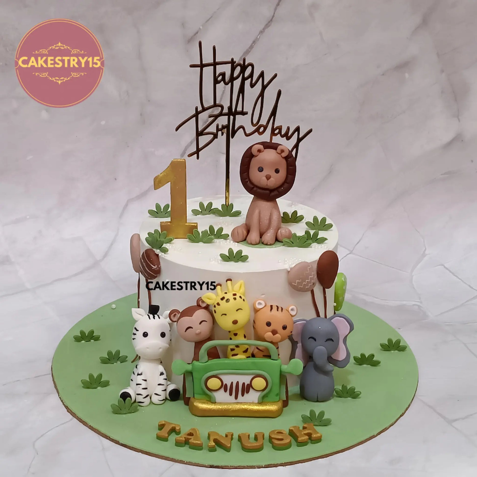 1.5kg choco chips jungle theme first birthday cake with fondant monkey, giraffe, tiger, zebra, elephant and lion from Cakestry15