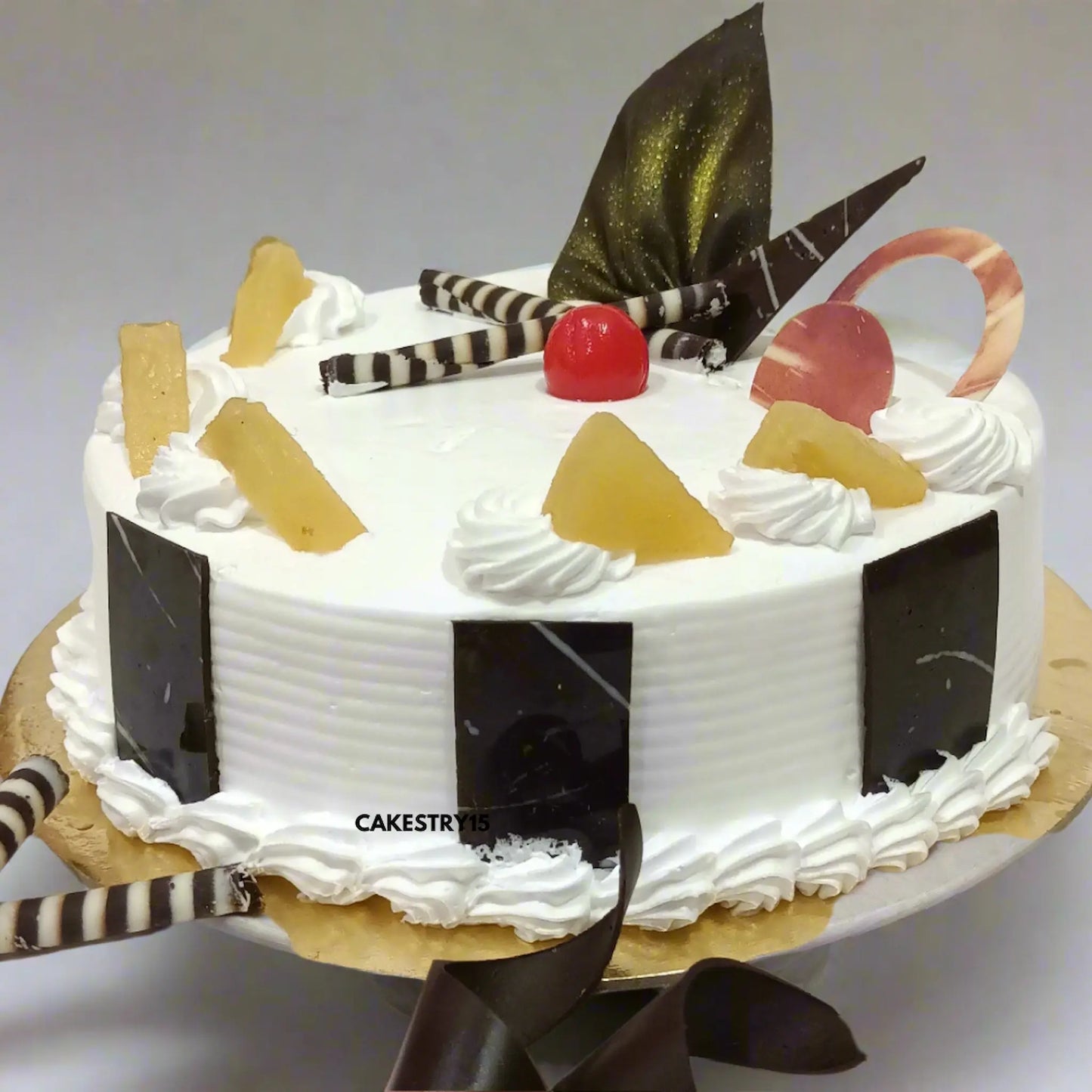 1kg pineapple cake with whipped cream and fruit topping from Cakestry15, Noida