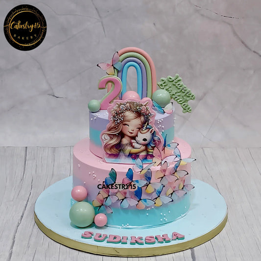 2-tier unicorn birthday cake with rainbow and edible baby girl image for 2nd birthday by cakestry15 noida