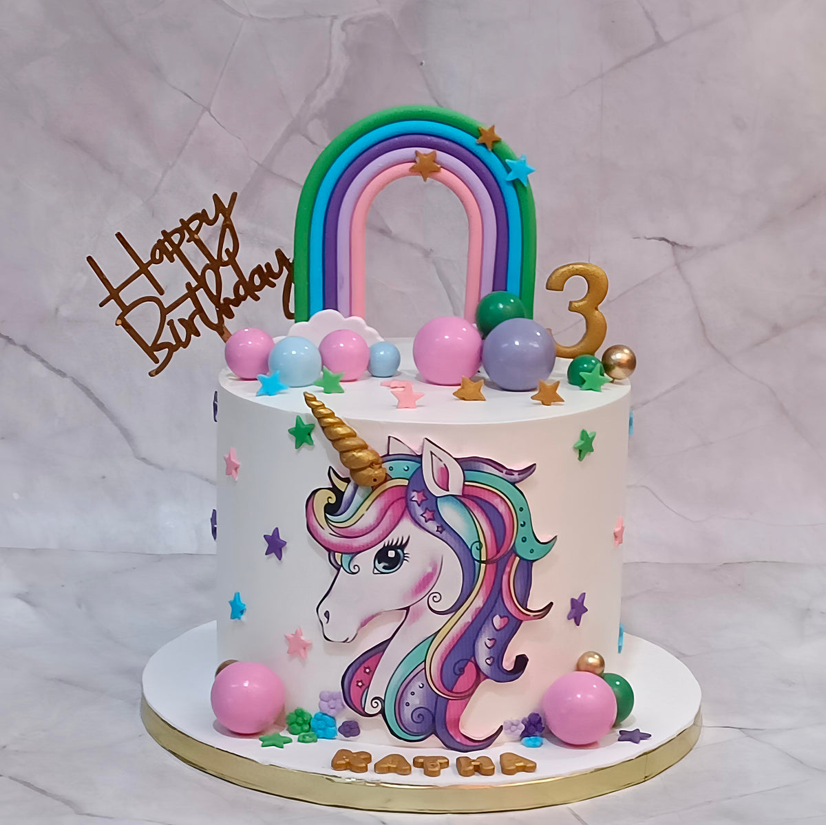 Unicorn Rainbow & Clouds 3rd Birthday Cake with an edible unicorn image, fondant rainbow, faux balls, clouds and stars.