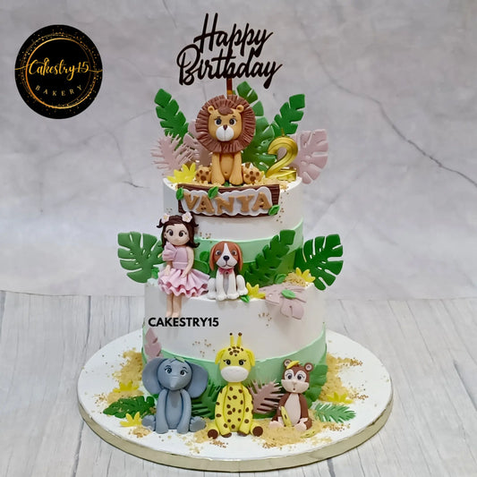 Vanya’s 2nd birthday jungle theme blueberry cake with animal and girl figurines