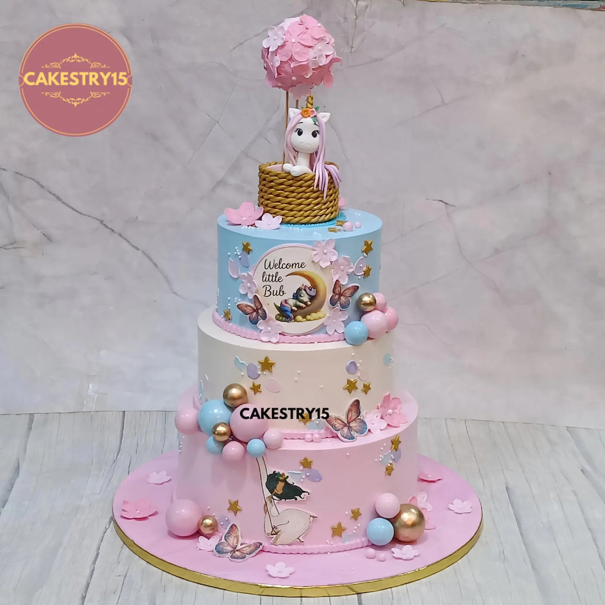 5kg chocolate 3-tier unicorn baby welcome cake by Cakestry15 with balloon and swing design by cakestry15
