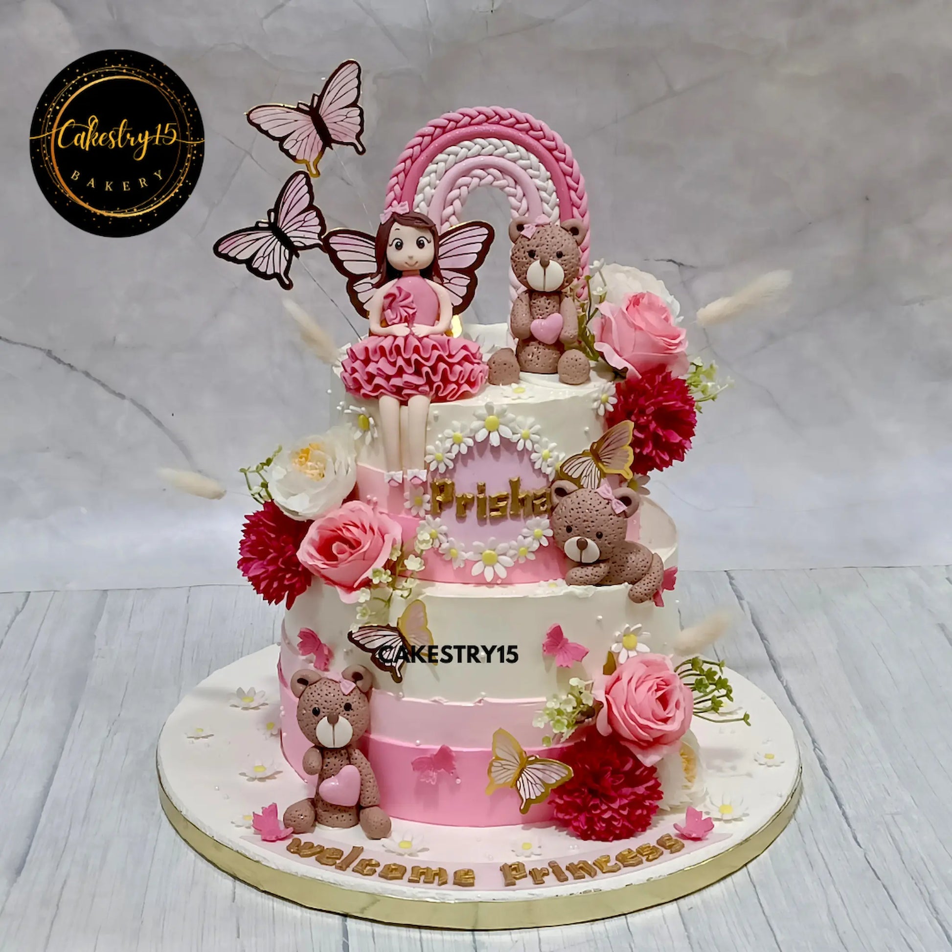 3kg chocolate baby girl welcome cake with rainbow, teddies, and floral details from Cakestry15