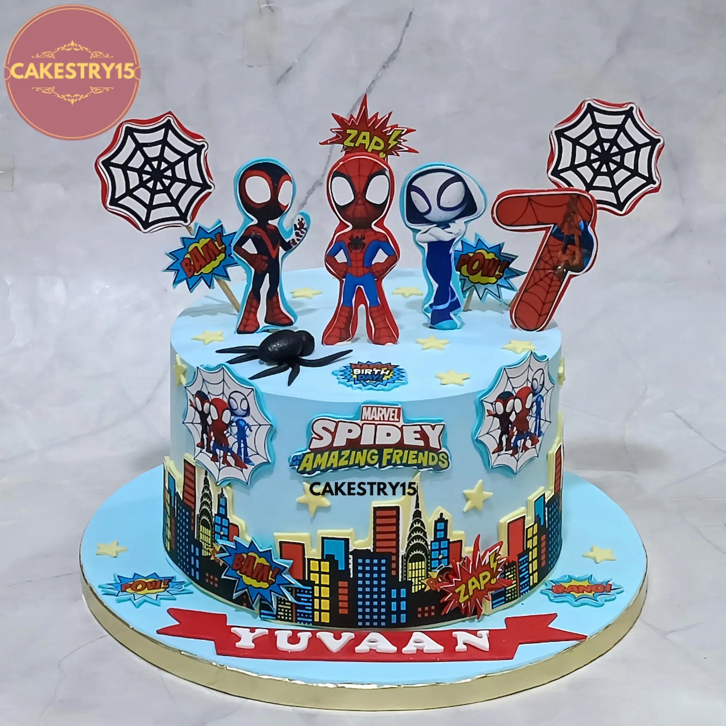 2kg chocolate Spiderman birthday cake from Cakestry15 with edible images of Spidey, city buildings, and cobwebs for a 7th birthday celebration in Noida
