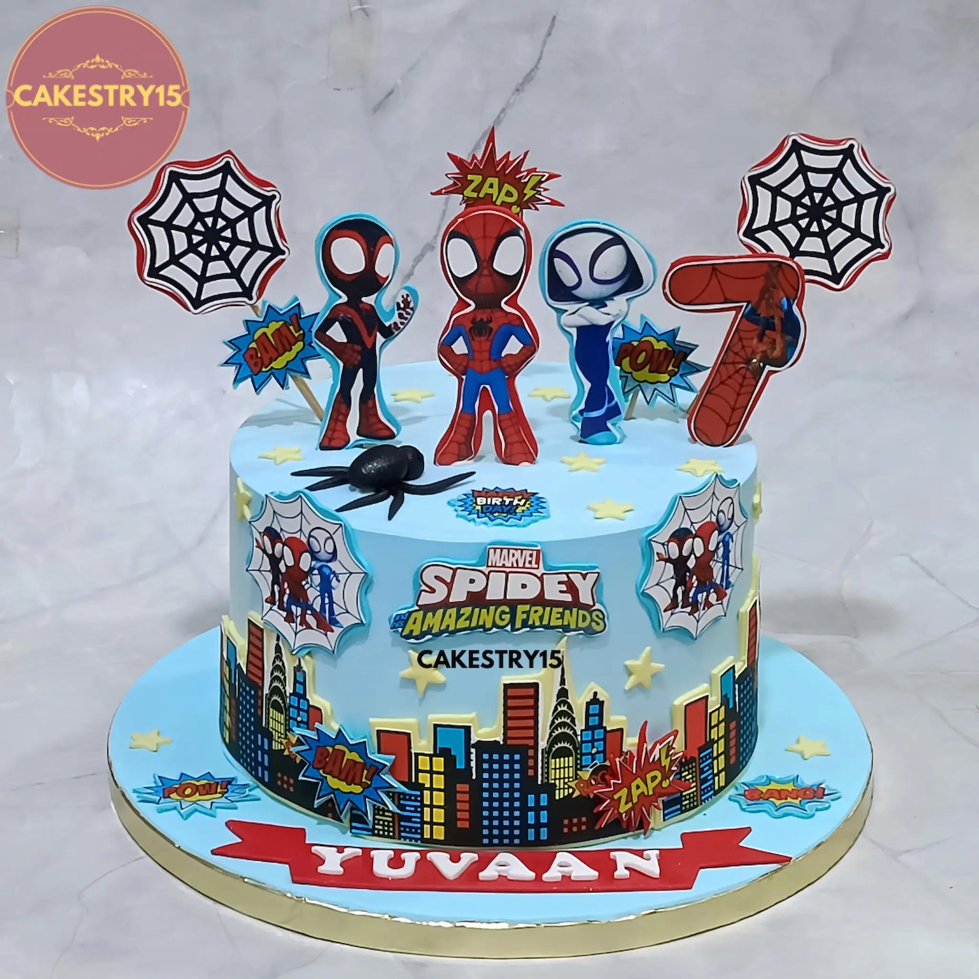 2kg chocolate Spiderman birthday cake from Cakestry15 with edible images of Spidey, city buildings, and cobwebs for a 7th birthday celebration in Noida