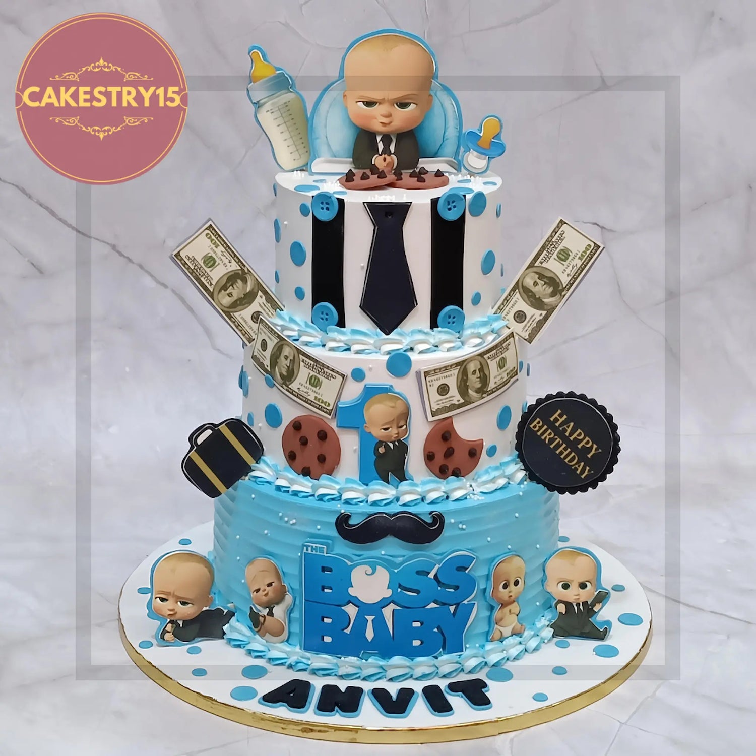 Boss Baby theme cake with baby figurine, tie, briefcase & office props