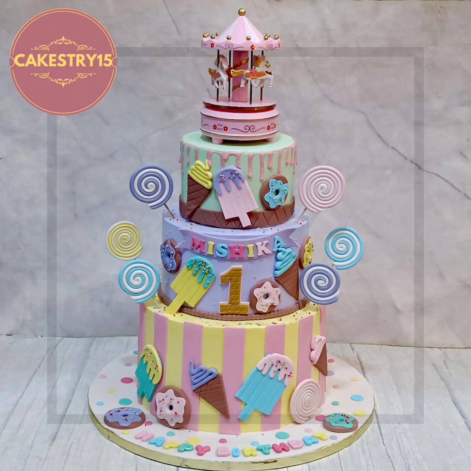 candyland theme cake with colorful layers, candy toppers, lollipops & sprinkles