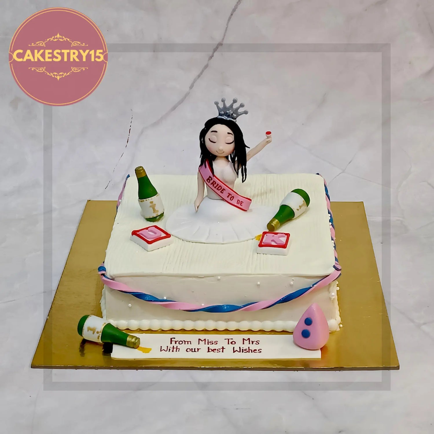 Bachelorette party cake with fun topper and champagne theme