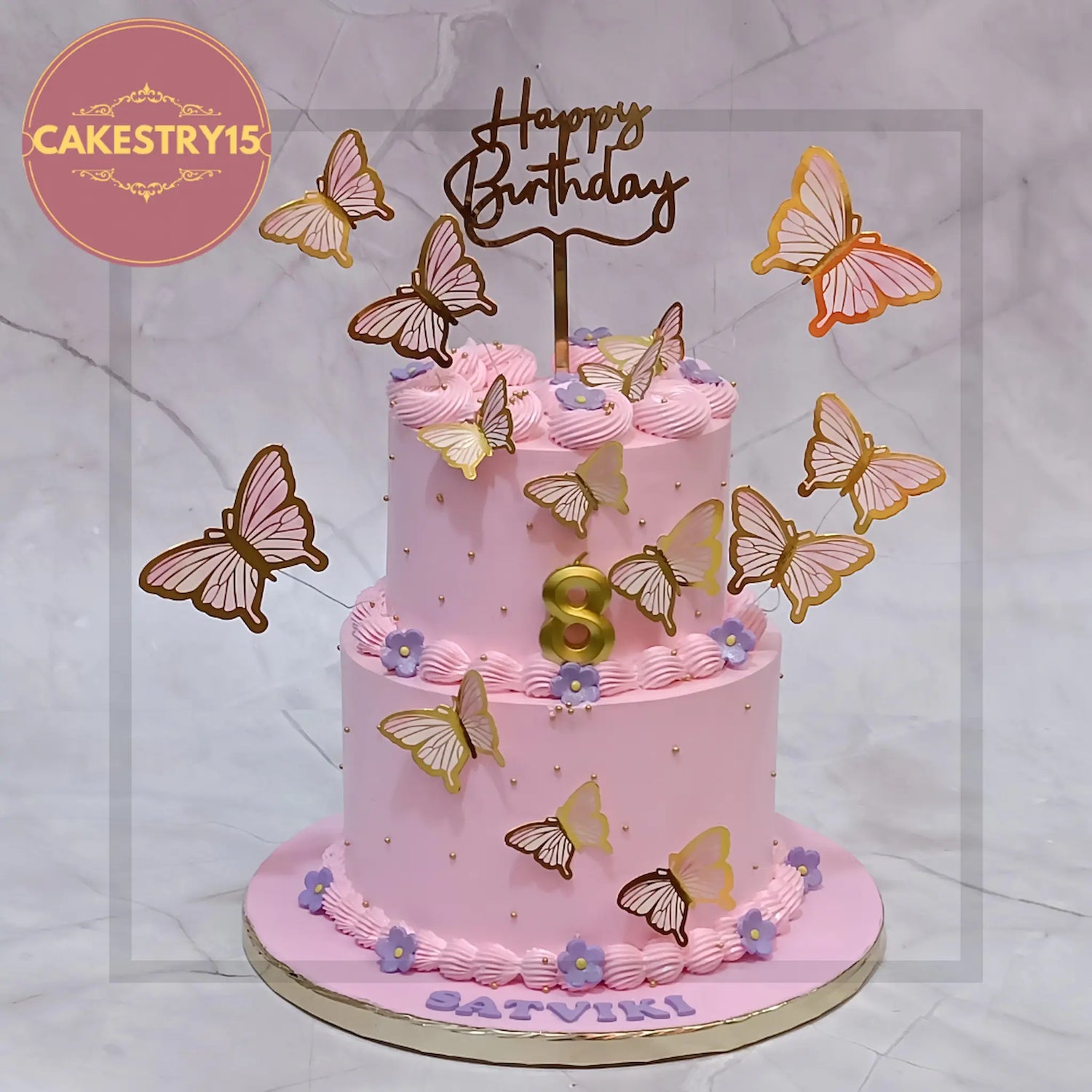 Elegant butterfly birthday cake for women with gold accents