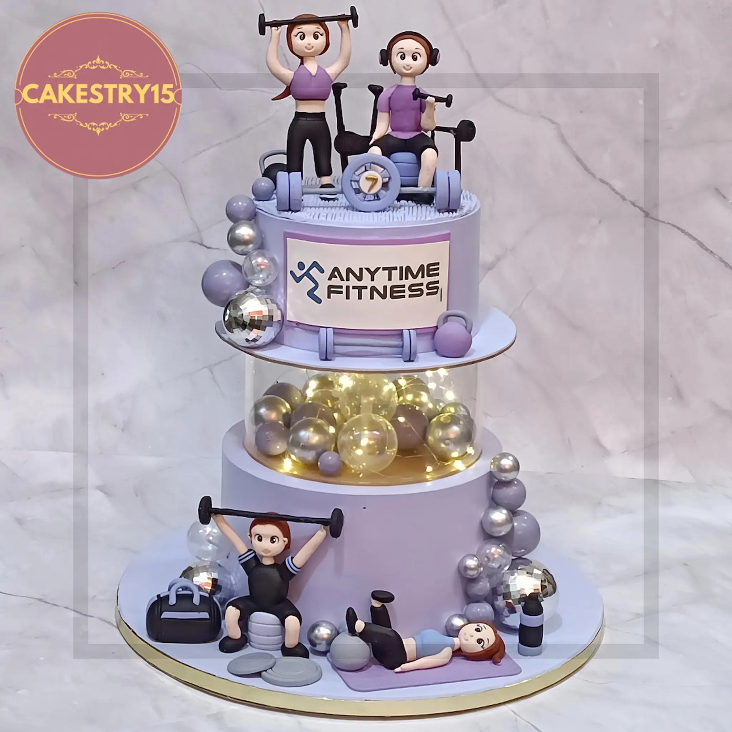 gym theme cake with people exercising