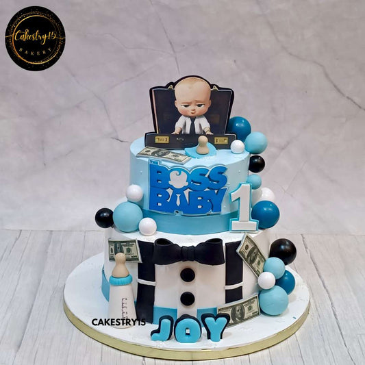 Boss Baby-themed first birthday cake with edible images, fondant milk bottle, currency notes, and an Age 1 tag in blue and white by cakestry15 noida