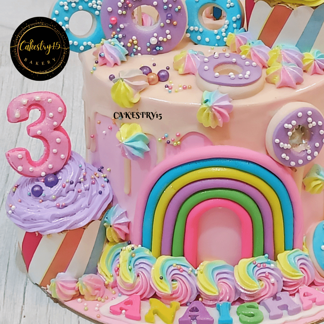 Candyland theme 1kg Vanilla flavour 3rd birthday cake,bottom tier close up image