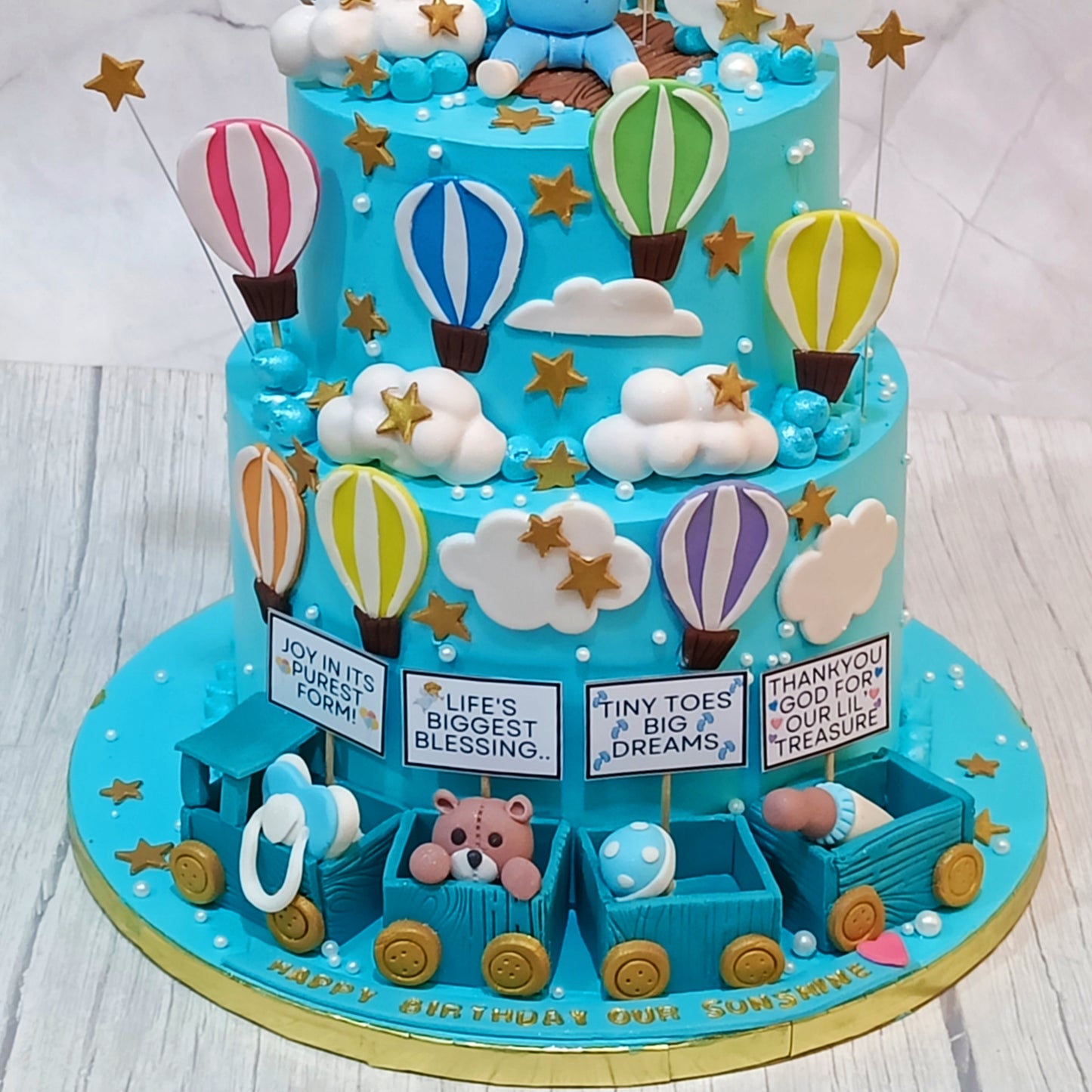 Teddy’s Sky-High Adventure 3kg chocolate first birthday Cake by cakestry1,noida,cake bottom tier close up image