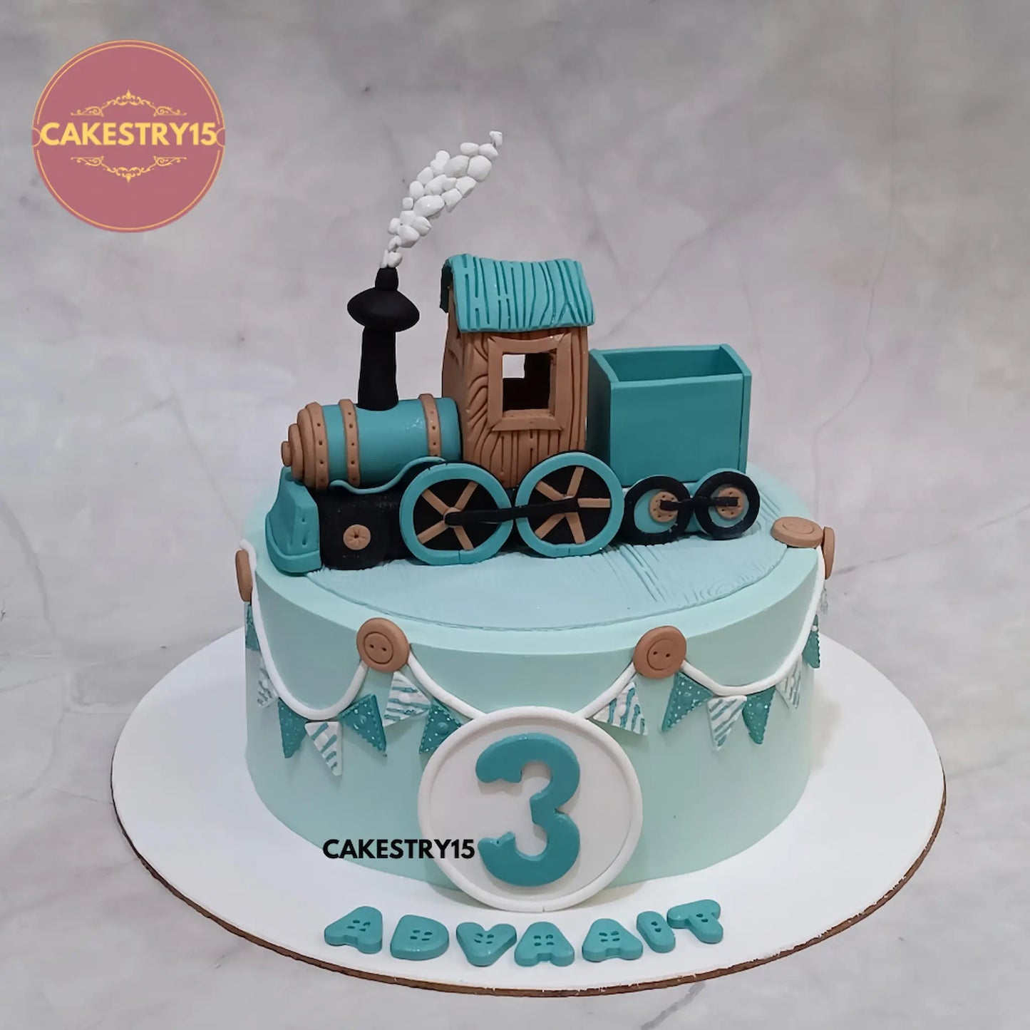 1kg pineapple cake with fondant train, custom name and age tag from Cakestry15

